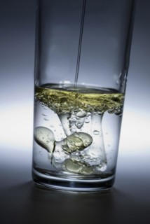 Oil poured in glass of water