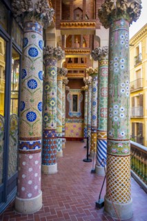 Columns with colourful mosaic on the outdoor terrace