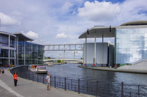 Excursion boat full of tourists on the Spree between Paul-Loebe- and Marie-Elisabeth-Lueders-Haus