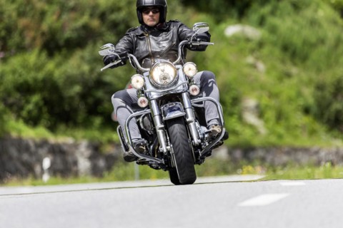 Motorbike on the winding Nufenen Pass in the Alps