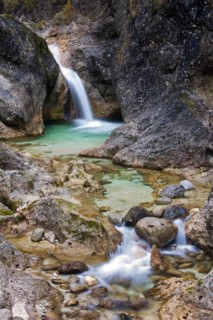 Waterfall in the river Almbach running through the Almbachklamm canyon in the Berchtesgaden Alps