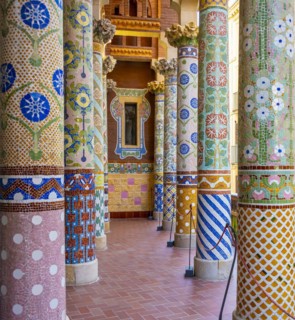 Columns with colourful mosaic on the outdoor terrace