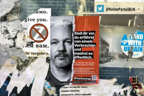 Sticker on a lamppost for Julian Assange