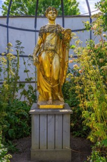 Golden statue under an arbour