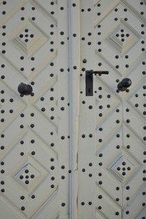 White house door from half-timbered house with fittings