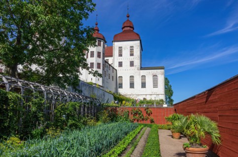 View of castle garden and baroque Laeckoe Castle on Kallandsoe in Vaenern in Vaestergoetland