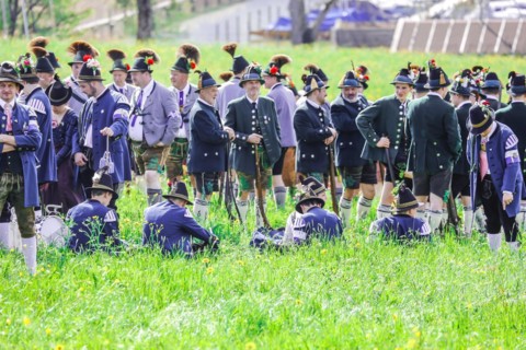 Mountain riflemen gather at the patron saint's day in a meadow near Gmund am Tegernsee