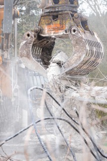 Excavator grab on demolition site