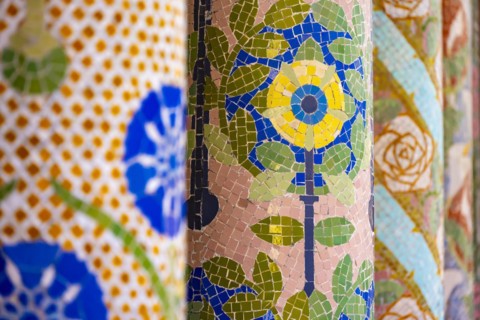 Columns with colourful mosaic on the outdoor terrace