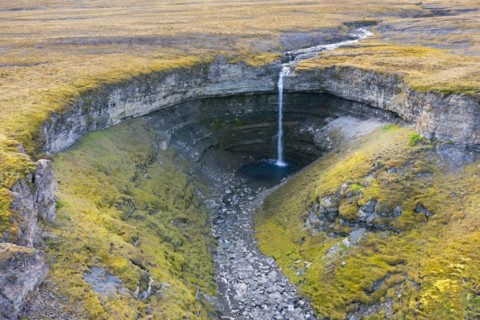 Waterfall Hemsilfossen on the Hemsil river at Ekmanfjorden in summer