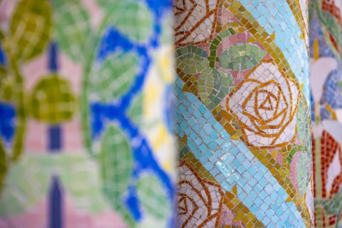 Columns with colourful mosaic on the outdoor terrace