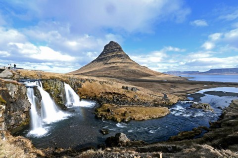 Kirkjufellsfoss waterfall and Kirkjufell mountain on the north coast of the Snaefellsnes peninsula in western Iceland