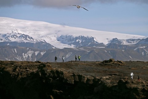 Small peninsula Dyrholaey on the south coast with view of the glacier Myrdalsjoekull
