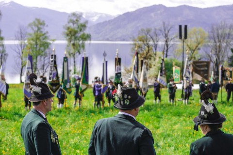 Mountain riflemen gather at the patron saint's day in a meadow near Gmund am Tegernsee