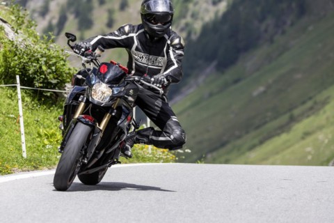 Motorbike on the winding Nufenen Pass in the Alps