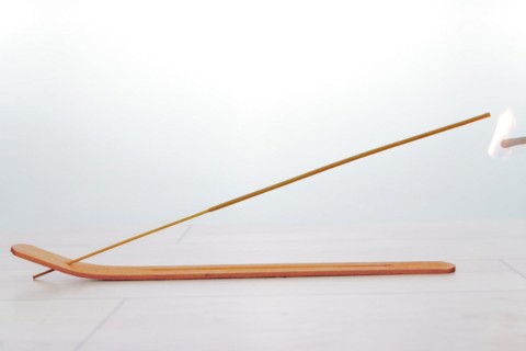Close-up of an incense stick isolated on a white background