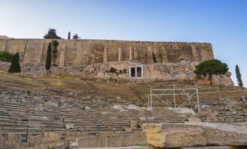 View of Acropolis walls and hill slopes and theater of Dionysus in Athens