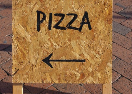 Pizza sign with direction arrow