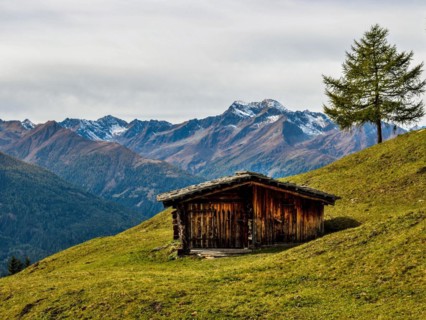 Hut on the mountain pasture in autumn with the Lasoerling