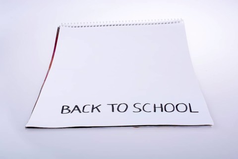 Notebook and back to school title on a notebook