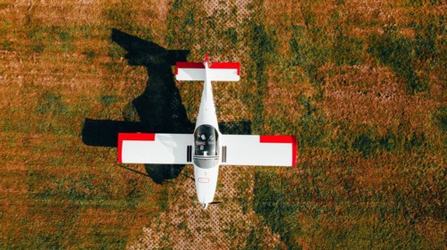 Red and white aircraft from above. Type Breezer B400-6