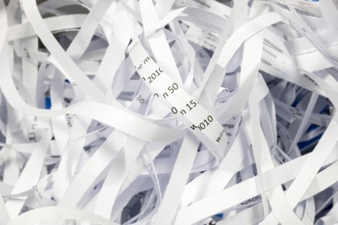 Paper strip documents made unrecognisable in the shredder