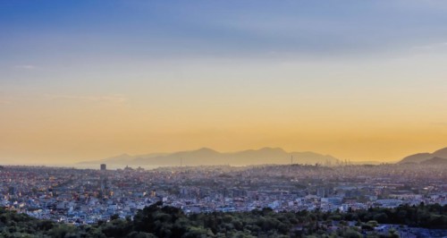 View of Athens and Pireus port from Acropolis hill against sunset
