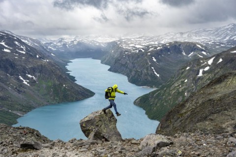 Climber jumps off rocks