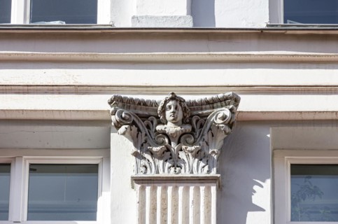 Facade detail face on a capital