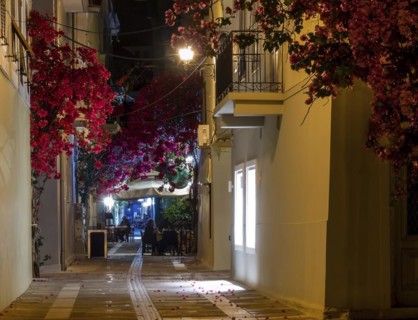 View of a narrow street and cafe in Nafplio