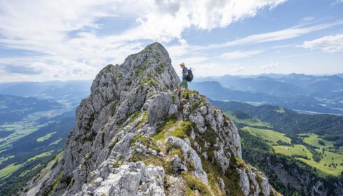 Mountaineer on a narrow ridge path