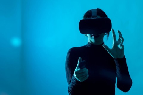 Metaverse technology concept. Woman with virtual reality VR glasses. Futuristic lifestyle