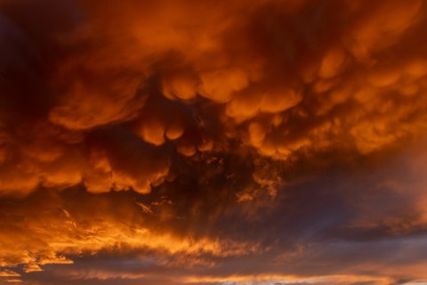Inflamed sky with mammatus clouds at sunset. Saintes Maries de la Mer