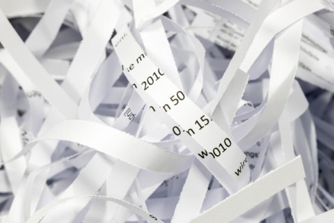 Paper strip documents made unrecognisable in the shredder