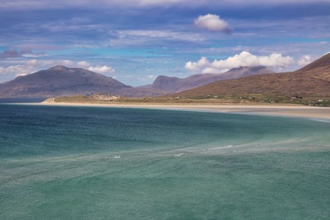 Coastline with sandy beach and mountains