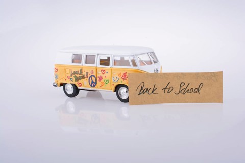 Travel van and back to school title and back to school title on a notebook