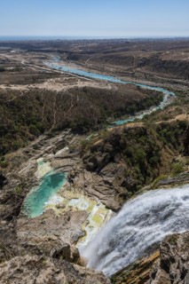 Huge waterfall with turquoise rockpools