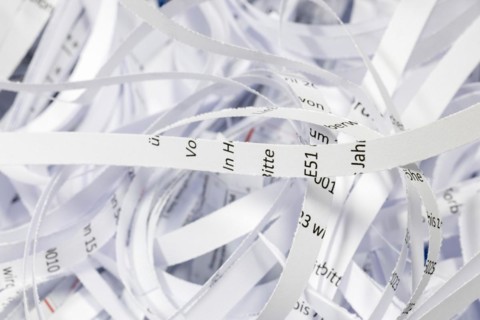 Paper strip documents made unrecognisable in the shredder