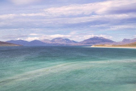 Coastline with sandy beach and mountains