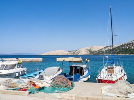 Boats in the harbour of Stara Baska