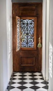 Trendy wooden front door from the inside house