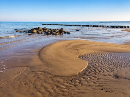 Pristine beach on the Baltic Sea with groynes