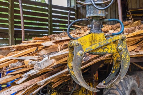 Machine Crane on a forestry vehicle forwarder to lifting logs