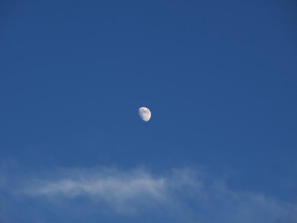 Waxing gibbous moon over blue sky