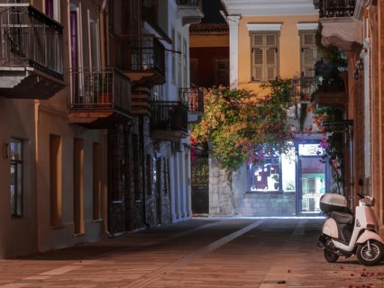 View of a narrow street and cafe in Nafplio