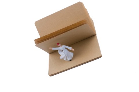 Sufi Dervish on a notebook on white background