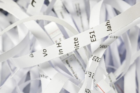 Paper strip documents made unrecognisable in the shredder