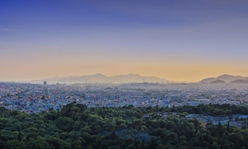 View of Athens and Pireus port from Acropolis hill against sunset