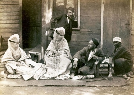 Turkish family in front of their home