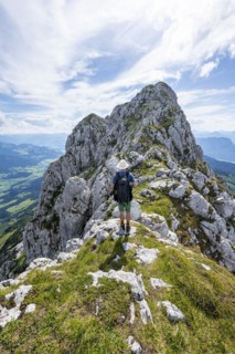 Mountaineer on a narrow ridge path